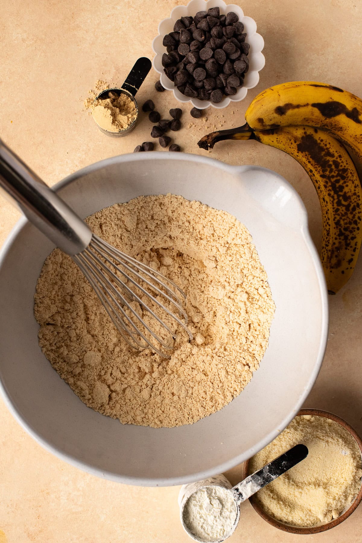 Dry ingredients for muffins whisked together in a bowl.
